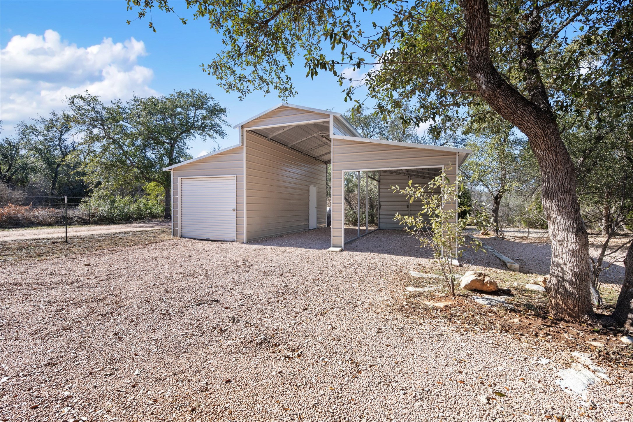 1610 Pace Bend Road North Spicewood, TX 78669 - Photo 14 of 32 a view of a backyard with large trees