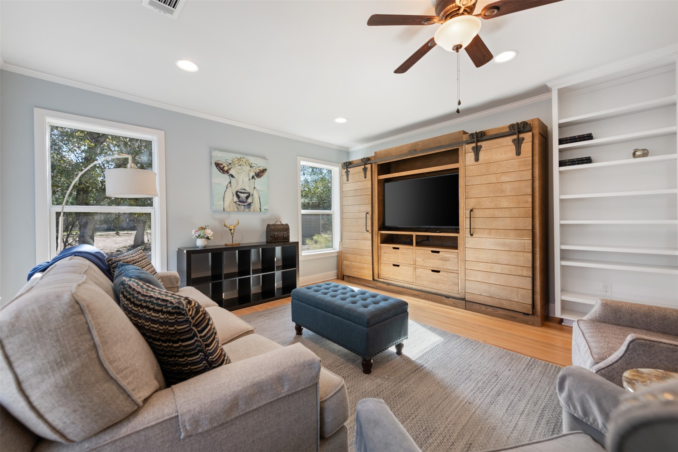 1610 Pace Bend Road North Spicewood, TX 78669 - Photo 2 of 32 a living room with furniture and a flat screen tv