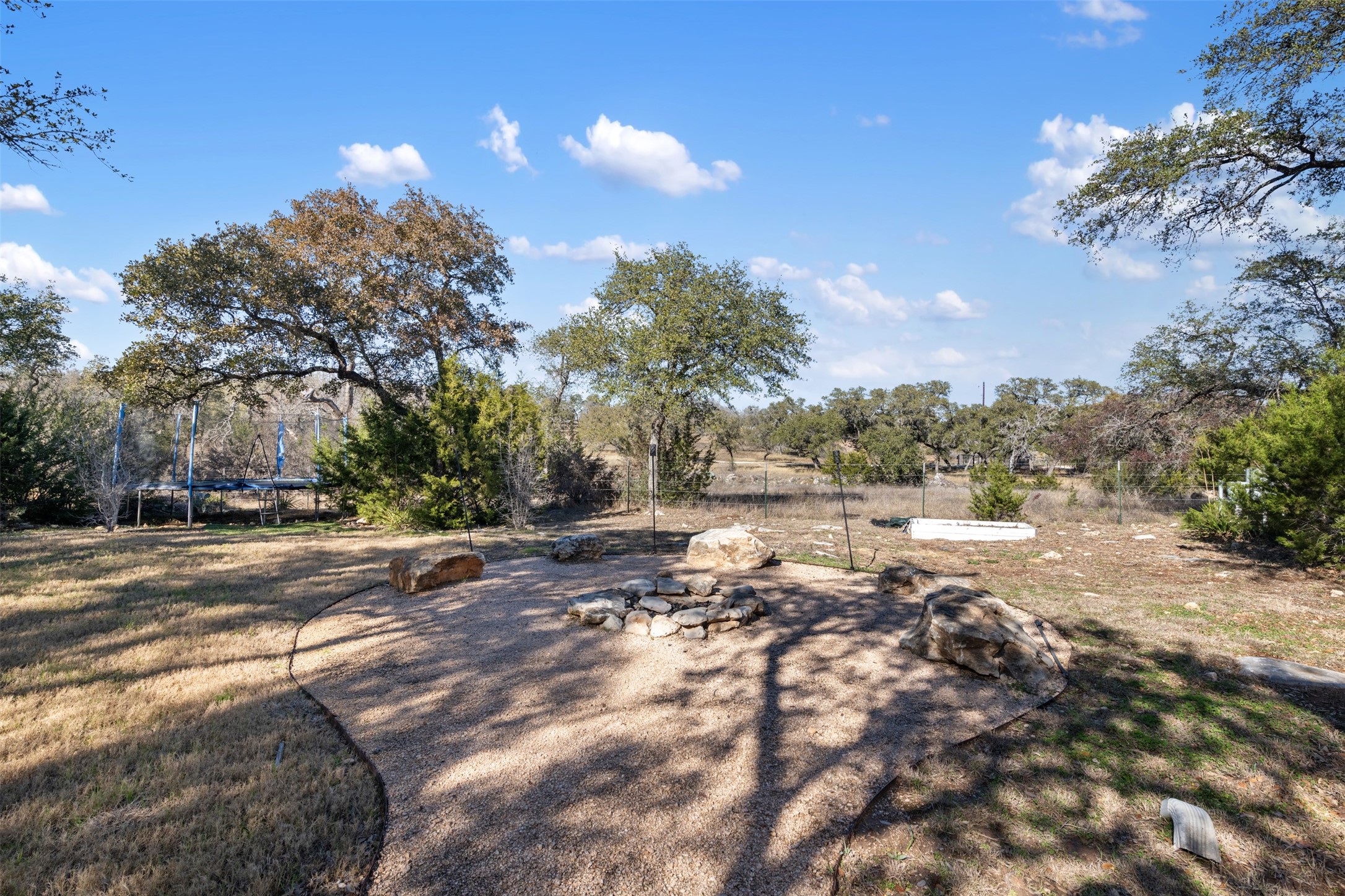 1610 Pace Bend Road North Spicewood, TX 78669 - Photo 29 of 32 a view of a yard with trees