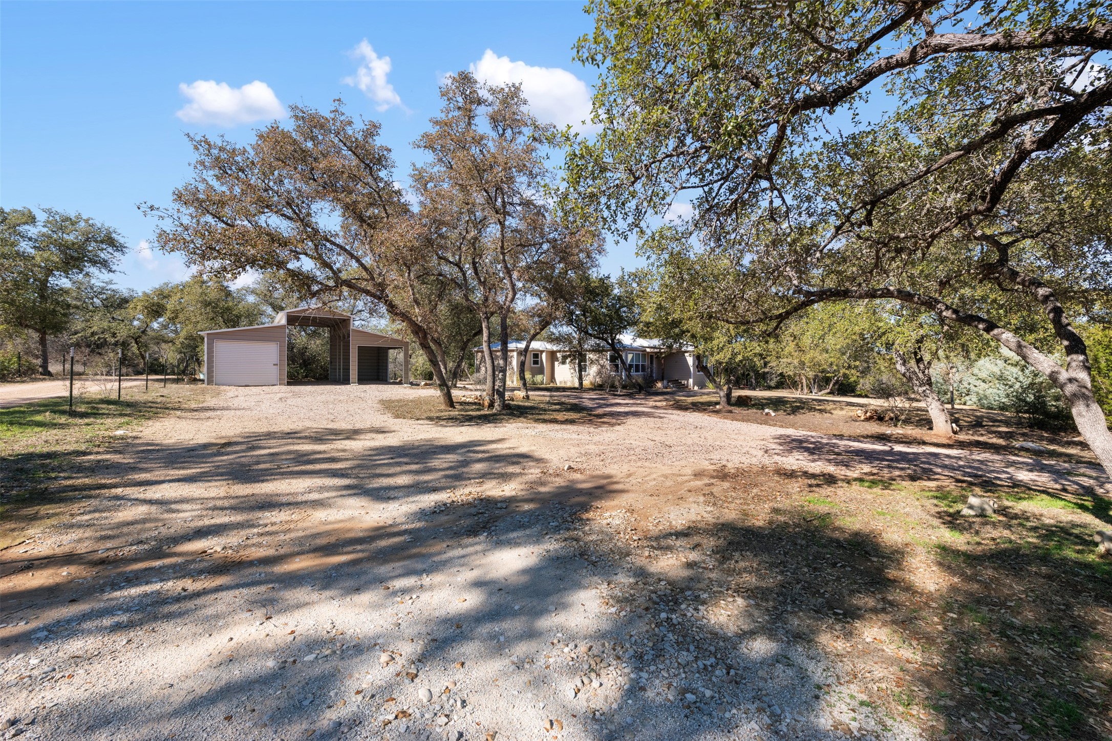1610 Pace Bend Road North Spicewood, TX 78669 - Photo 31 of 32 a view of road with large trees