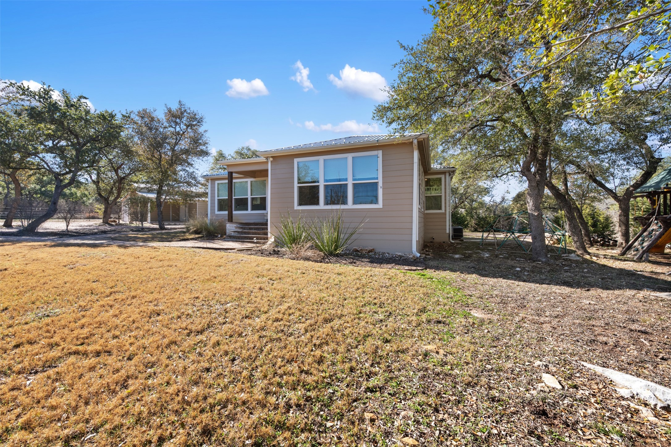 1610 Pace Bend Road North Spicewood, TX 78669 - Photo 32 of 32 a house view with a outdoor space