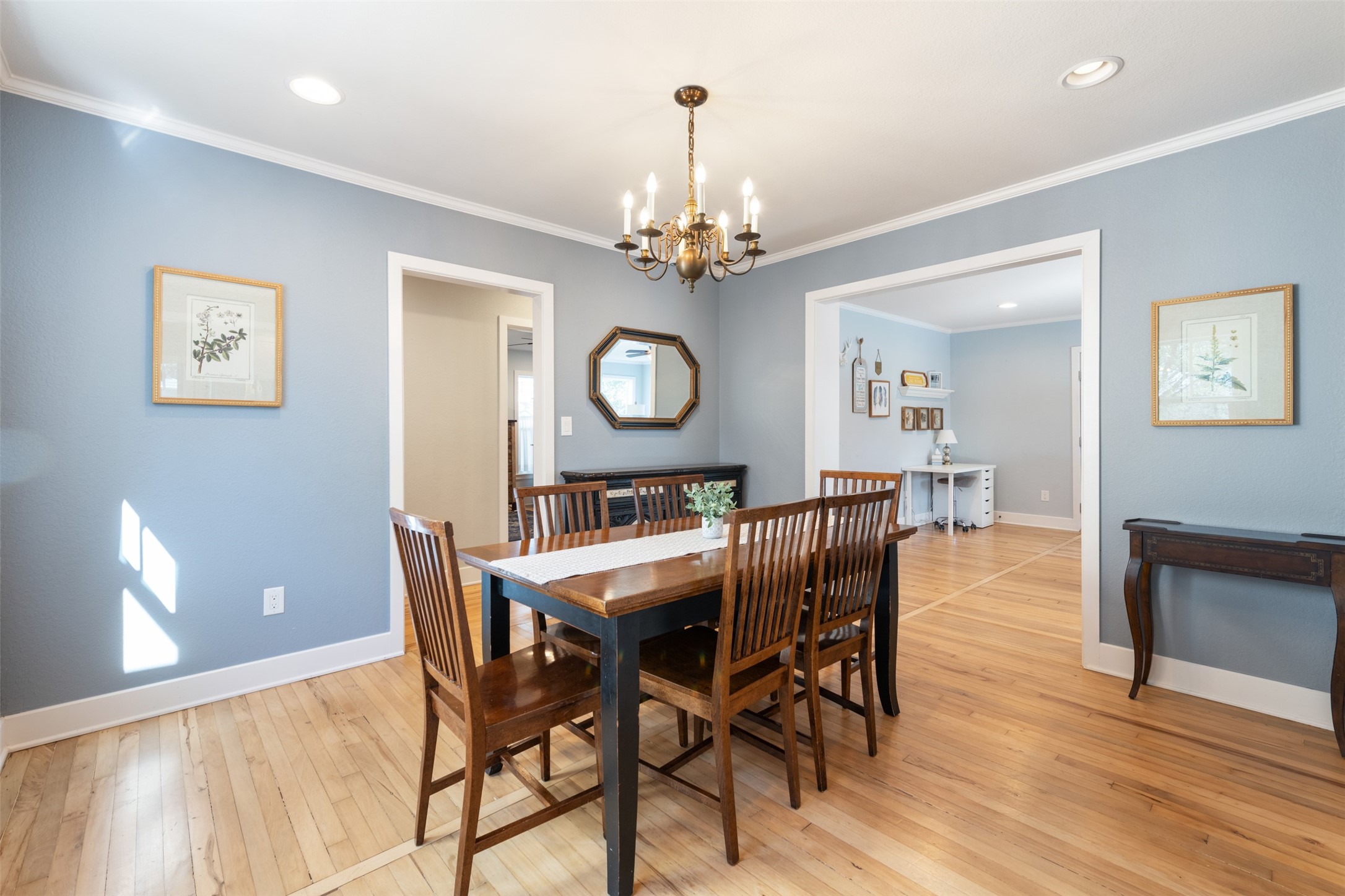 1610 Pace Bend Road North Spicewood, TX 78669 - Photo 4 of 32 a view of a dining room with furniture wooden floor and a chandelier