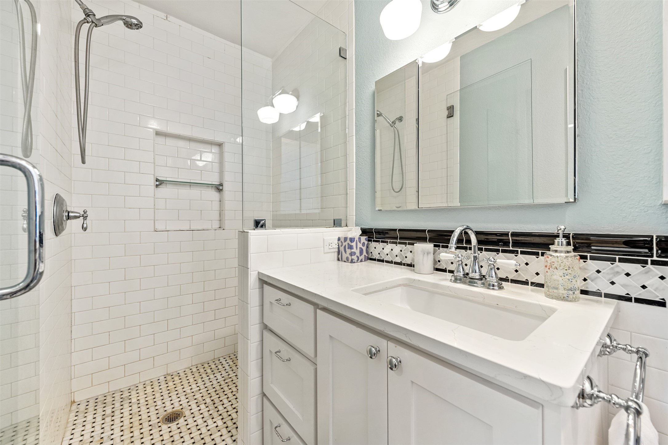 1610 Pace Bend Road North Spicewood, TX 78669 - Photo 8 of 32 a bathroom with a sink double vanity and a shower