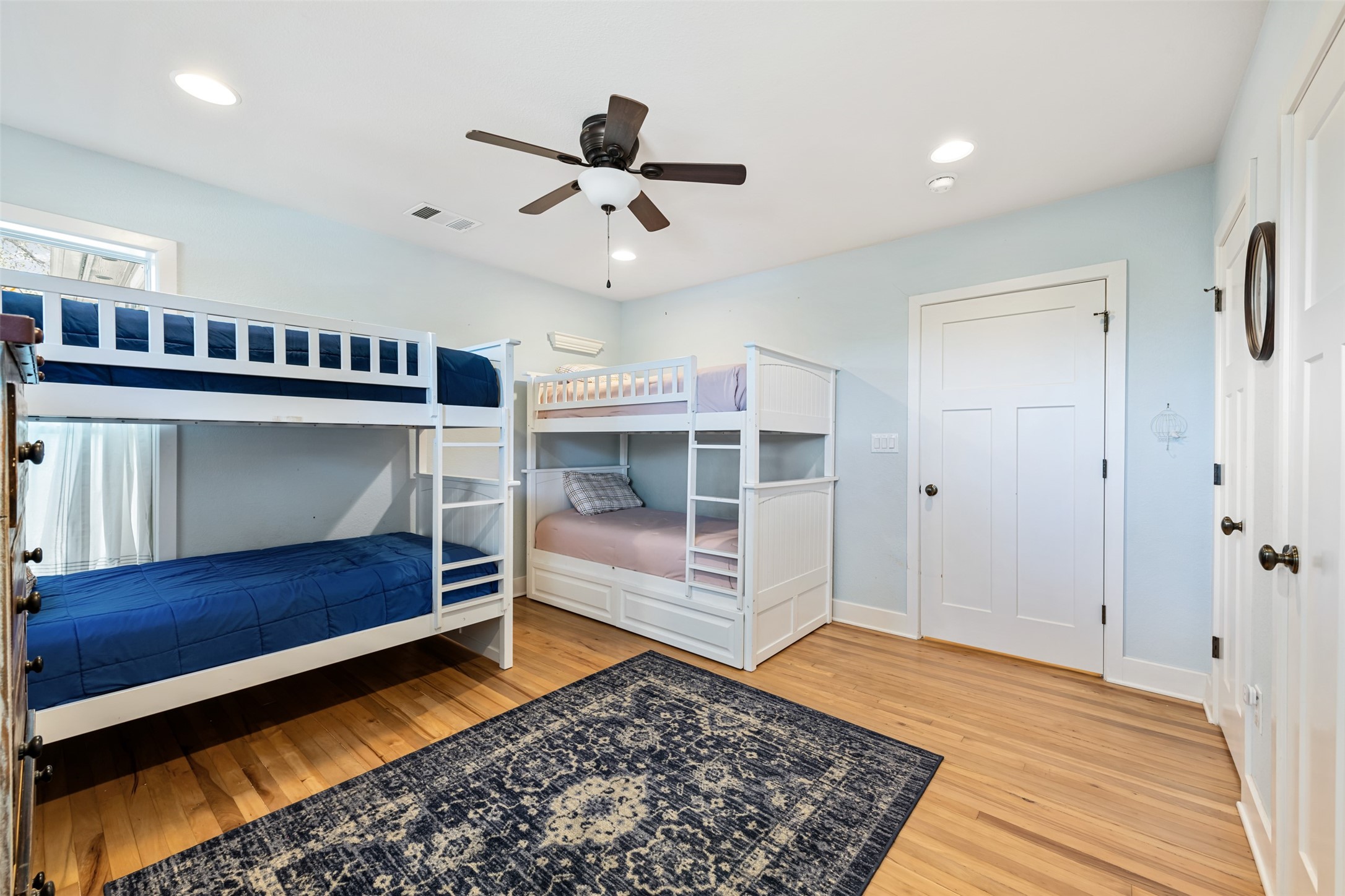 1610 Pace Bend Road North Spicewood, TX 78669 - Photo 10 of 32 a bedroom with a bed and a dresser