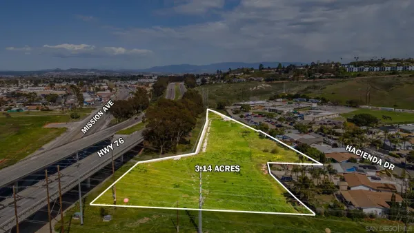 a view of a city with an ocean view