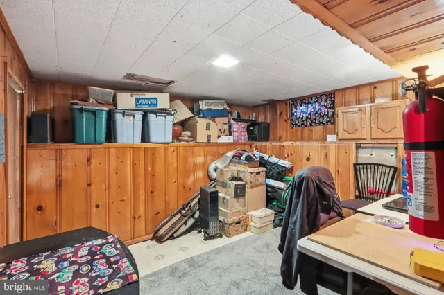 a view of a room with furniture and workspace
