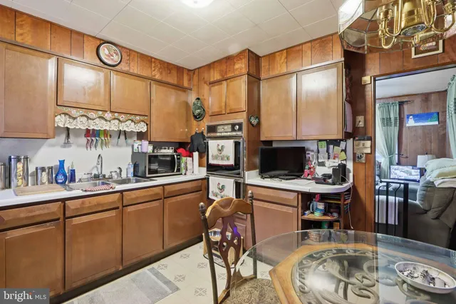 a kitchen with stainless steel appliances granite countertop a sink and cabinets