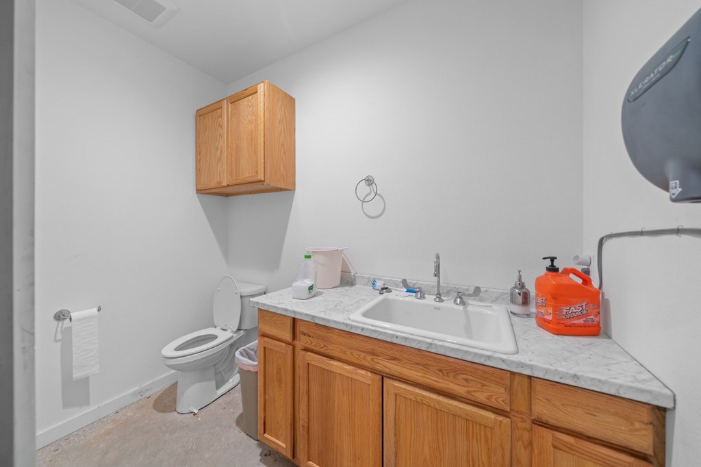 0 County Road 289 Ballinger, TX 76821 - Photo 36 of 61 a bathroom with a sink a toilet and a mirror