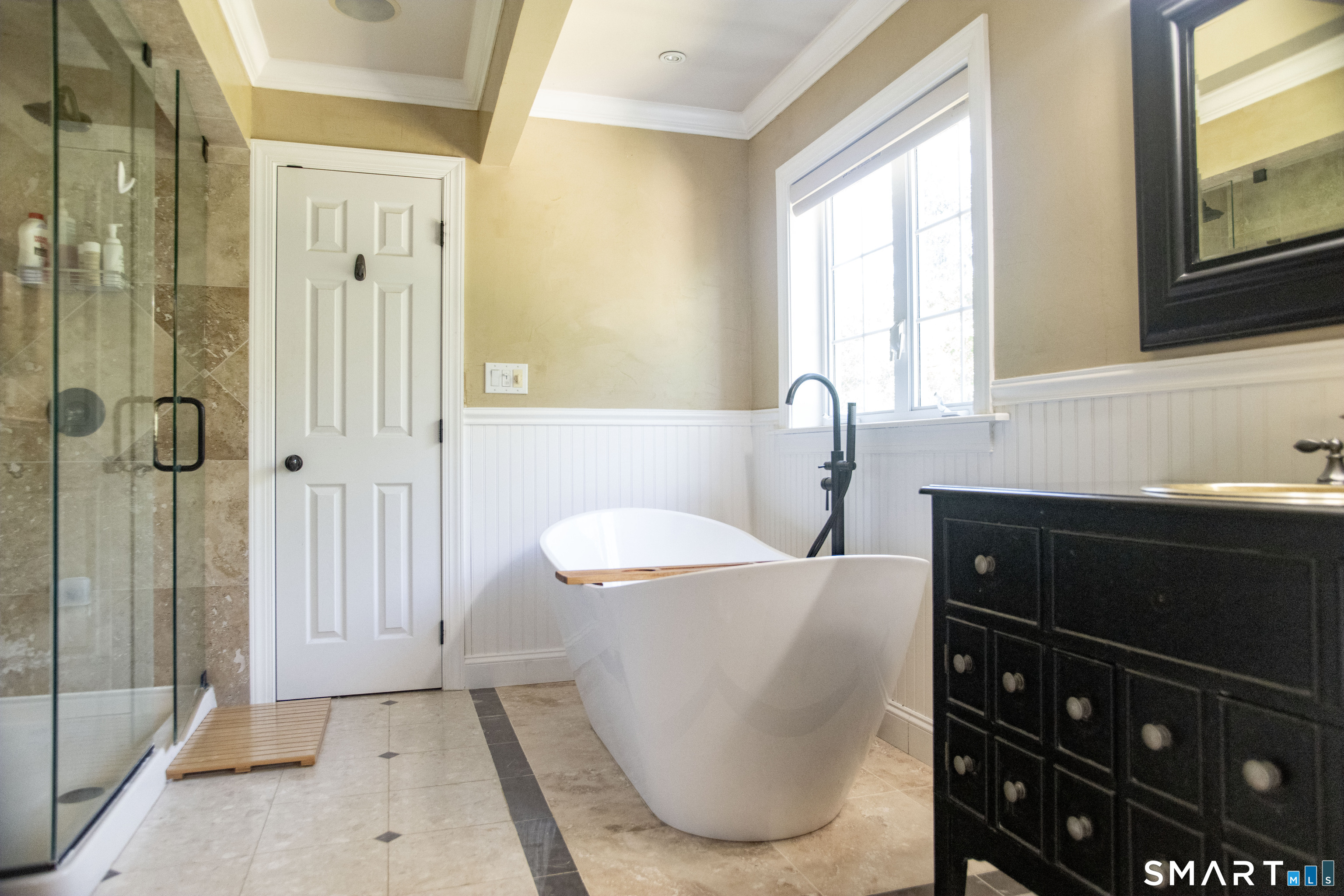 25 Starrs Ridge Road Redding, CT 06896 - Photo 23 of 38 Designed with relaxation in mind, the primary bath showcases a freestanding soaking tub, glass enclosed steam shower, and a spacious layout that creates a true spa-inspired retreat.