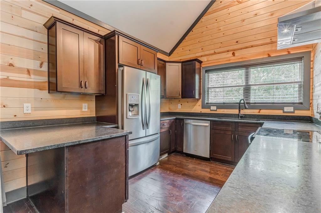 850 Bethel Church Road Southeast Silver Creek, GA 30173 - Photo 11 of 52 a kitchen with granite countertop a refrigerator and a sink