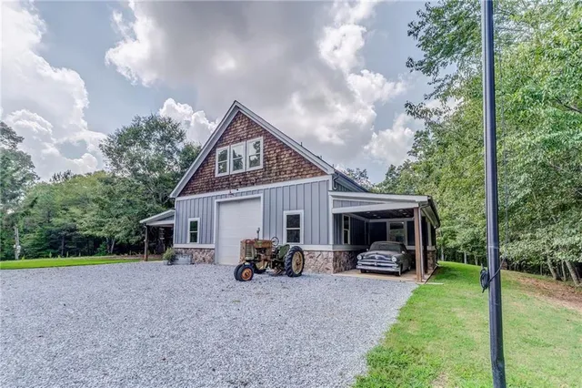 a view of a house with backyard and porch