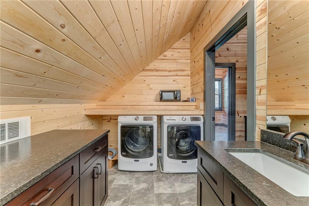 850 Bethel Church Road Southeast Silver Creek, GA 30173 - Photo 26 of 52 a utility room with a sink a washer and dryer