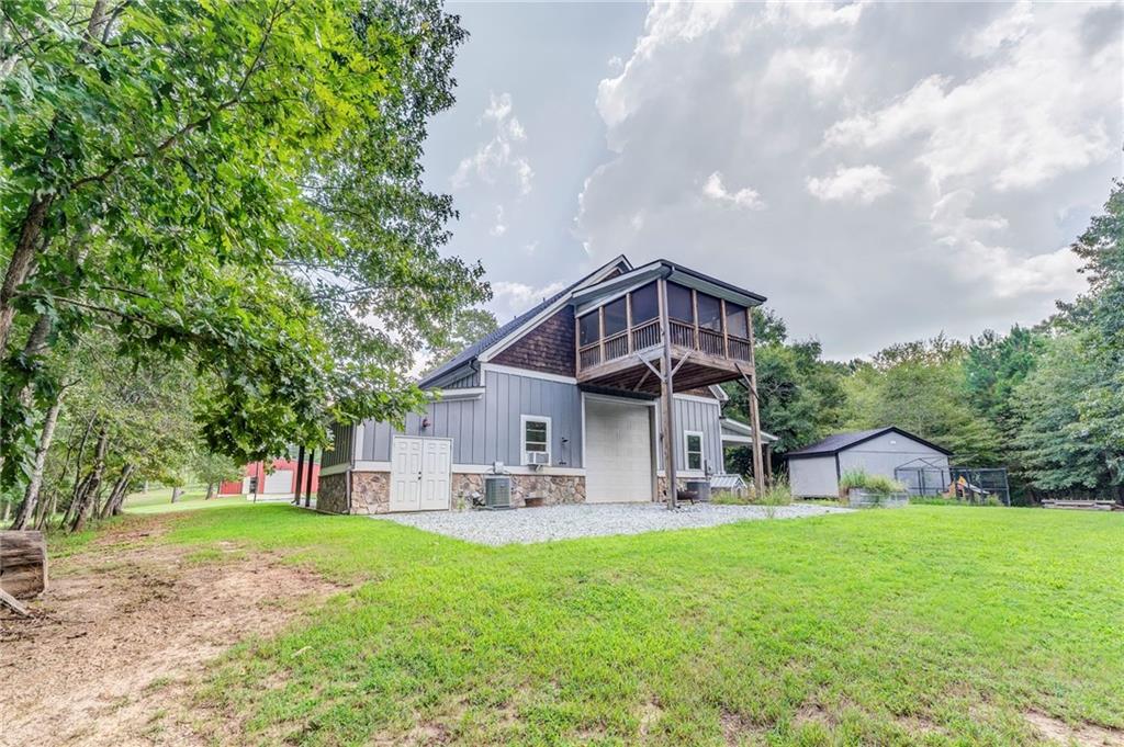 850 Bethel Church Road Southeast Silver Creek, GA 30173 - Photo 3 of 52 a front view of a house with garden