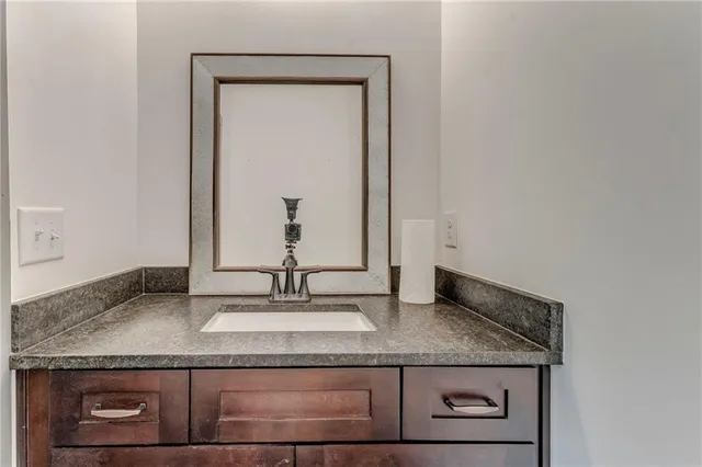 a picture of a bathroom with a shower