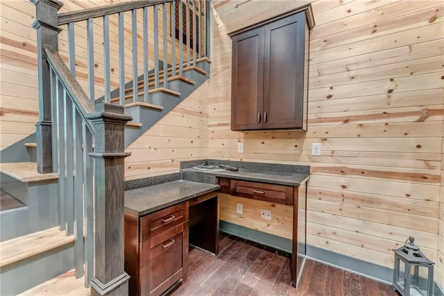 a view of a kitchen with a sink and cabinets