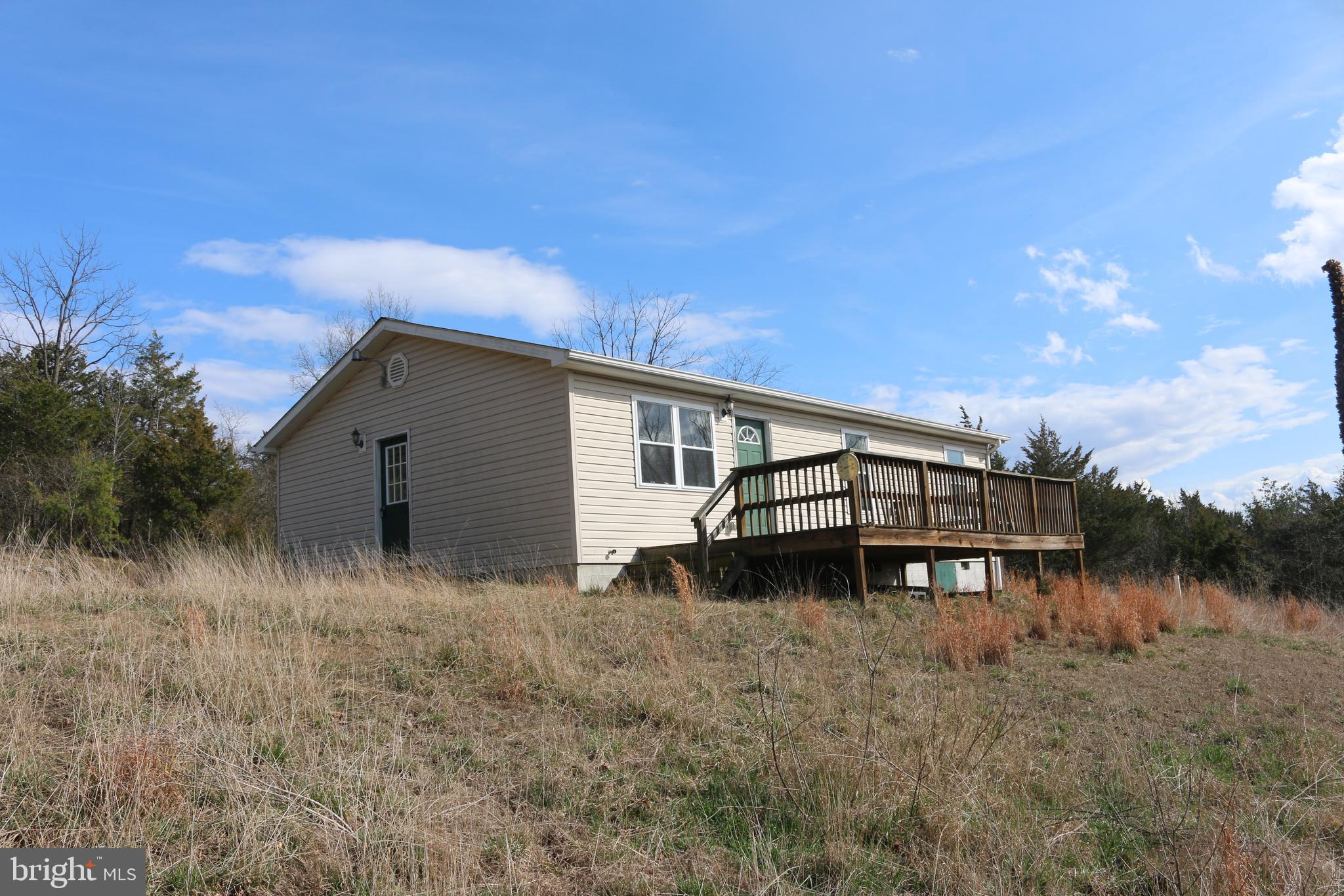 156 Squirrel Den Road Maysville, WV 26833 - Photo 41 of 41 a view of a house with a yard