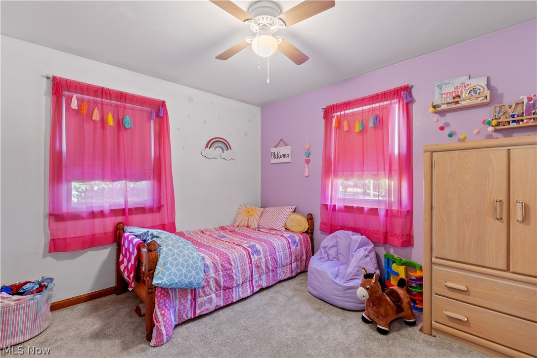 1724 Spring Valley Avenue Northwest Canton, OH 44708 - Photo 13 of 30 Bedroom featuring light carpet and ceiling fan