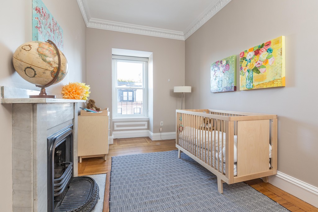 193 Beacon Street, Unit 4 Boston, MA 02116 - Photo 12 of 22 a living room with furniture and a fireplace