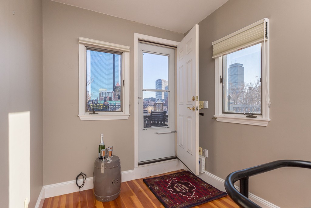 193 Beacon Street, Unit 4 Boston, MA 02116 - Photo 18 of 22 a room that has a window and wooden floor