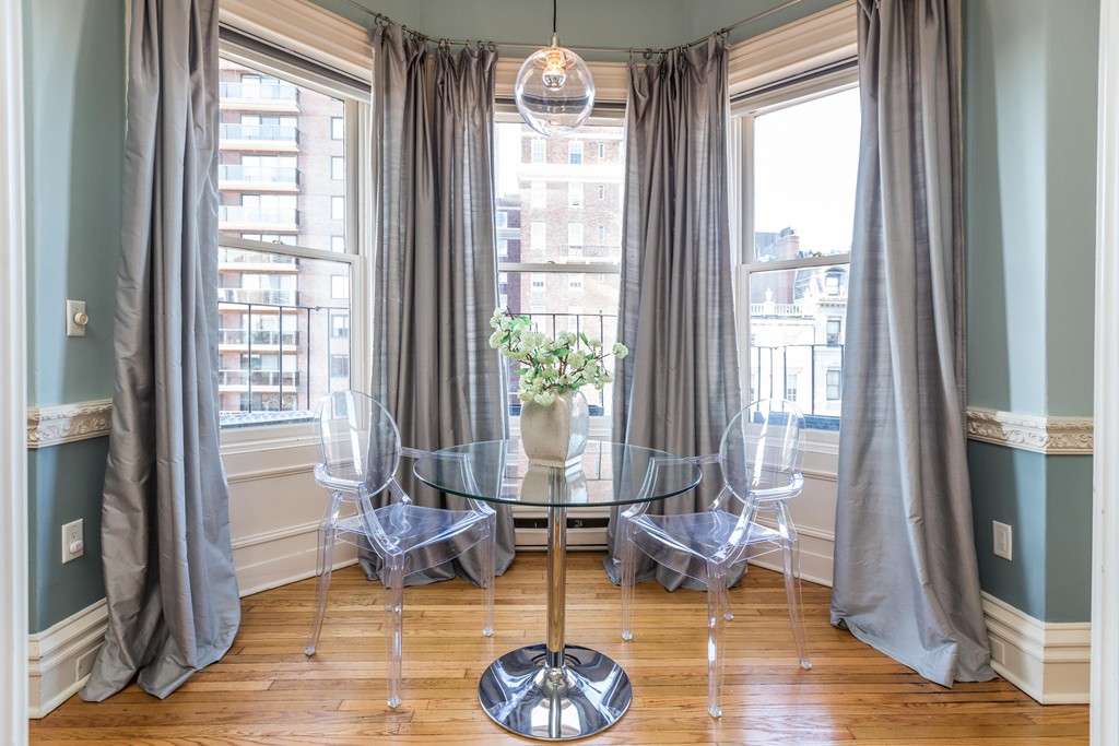 193 Beacon Street, Unit 4 Boston, MA 02116 - Photo 2 of 22 a living room with furniture and a large window