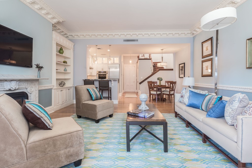193 Beacon Street, Unit 4 Boston, MA 02116 - Photo 3 of 22 a living room with fireplace furniture and a flat screen tv