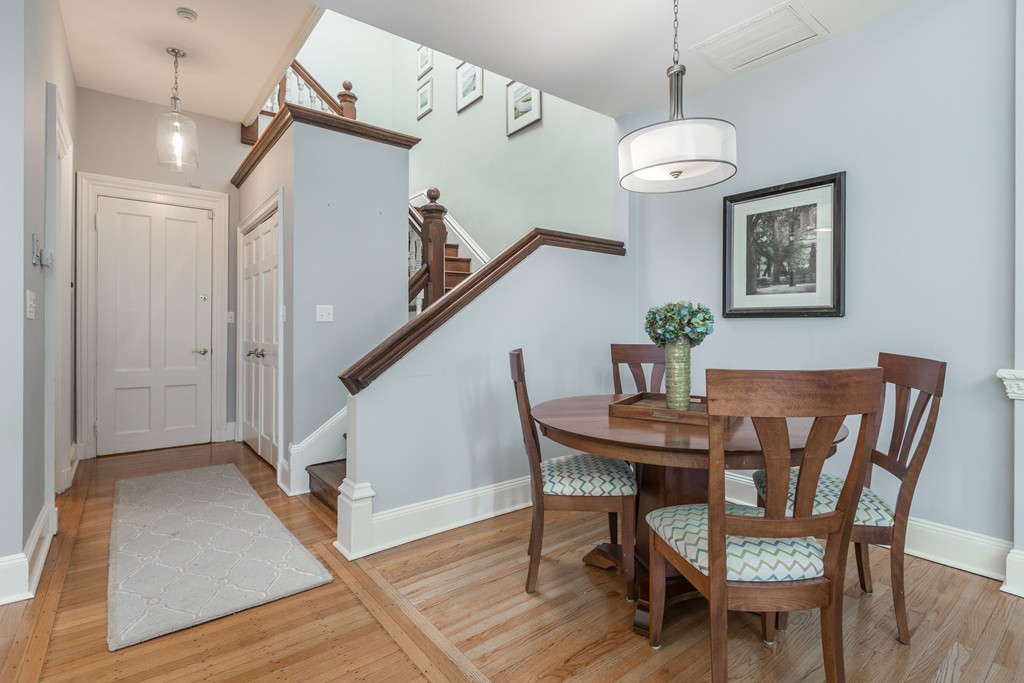 193 Beacon Street, Unit 4 Boston, MA 02116 - Photo 5 of 22 a view of a dining room with furniture and wooden floor