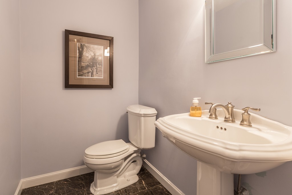 193 Beacon Street, Unit 4 Boston, MA 02116 - Photo 9 of 22 a white toilet sitting next to a white sink