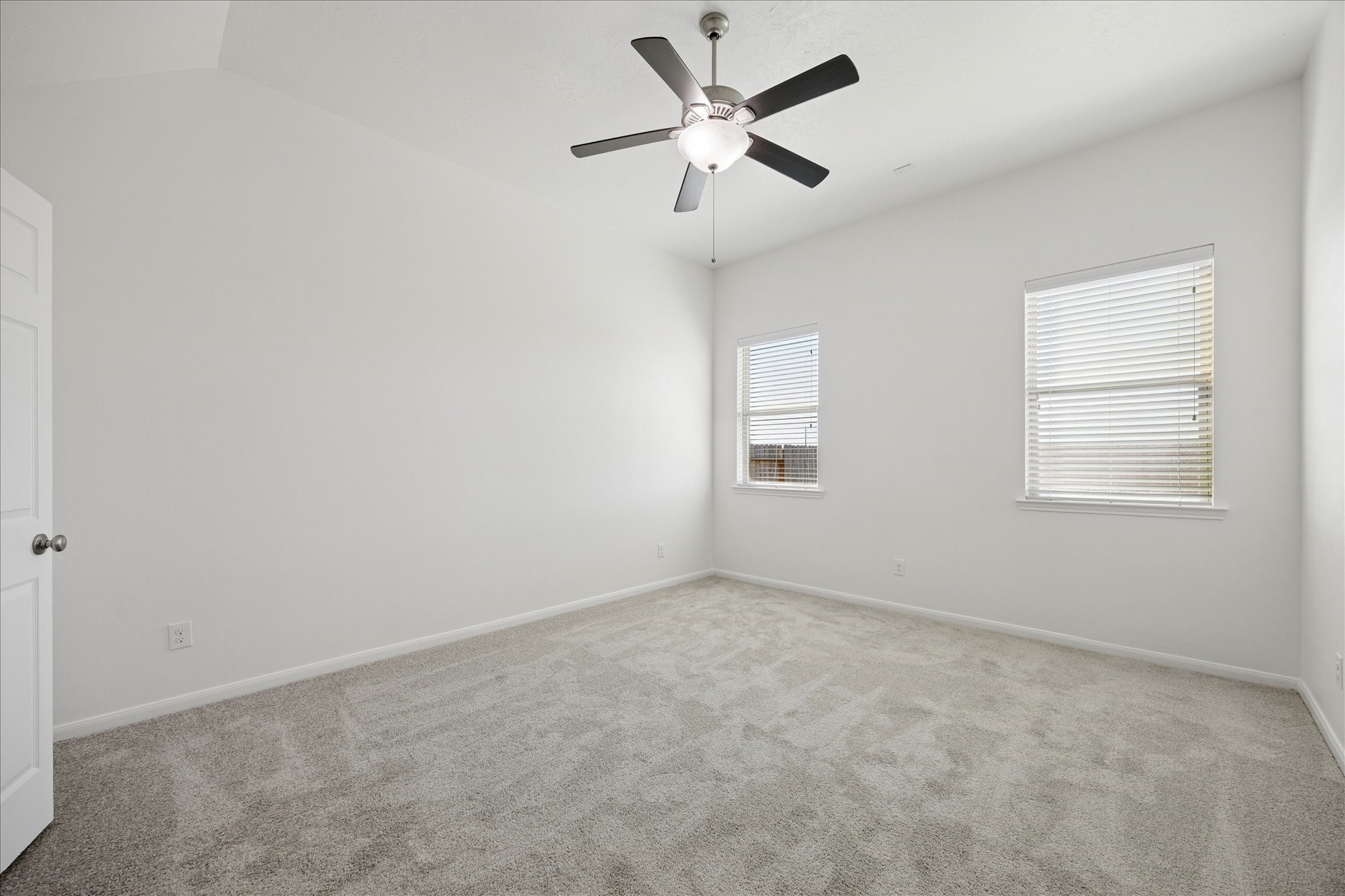 8115 Aleppo Pine Lane Cypress, TX 77433 - Photo 18 of 32 an empty room with a window and a fan