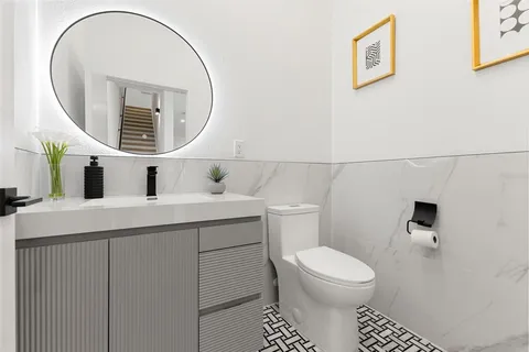 a bedroom with furniture and a large window