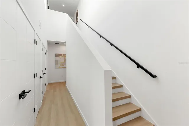 a view of a workspace room with furniture and wooden floor