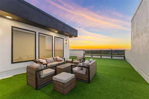 a view of a swimming pool with furniture