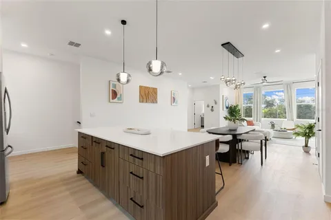 a kitchen with a sink counter top space appliances and cabinets