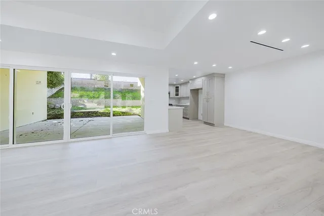 a view of an empty room with a sliding door