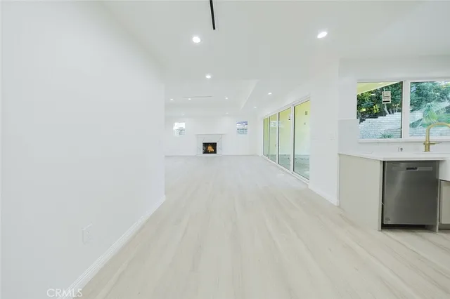 a view of a kitchen with a sink and a window
