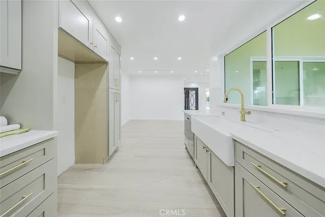 a bathroom with double vanity and a mirror