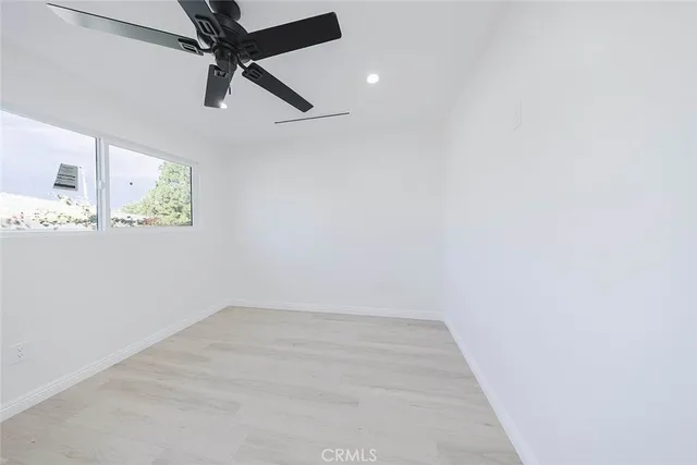 a bathroom with a shower and sink