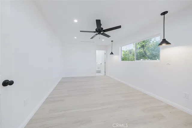 a bathroom with a toilet sink and shower