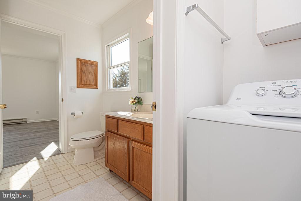 36130 Richland Road Willards, MD 21874 - Photo 13 of 42 a bathroom with a toilet sink and mirror