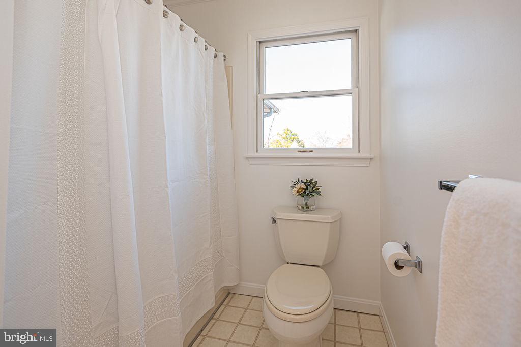 36130 Richland Road Willards, MD 21874 - Photo 23 of 42 a a bathroom with a toilet a sink and a window