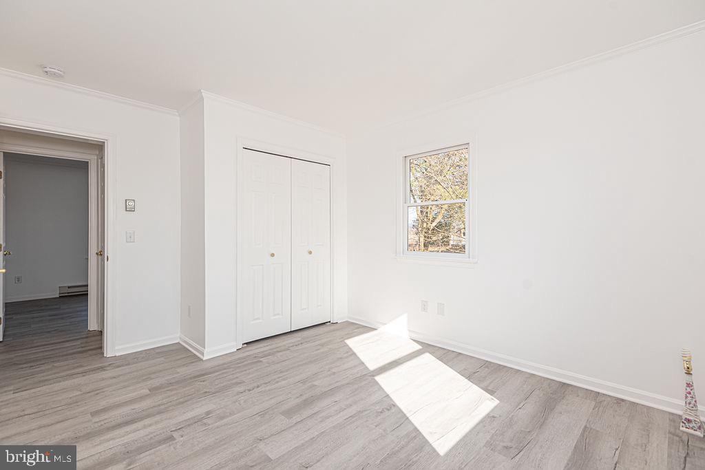 36130 Richland Road Willards, MD 21874 - Photo 28 of 42 an empty room with wooden floor