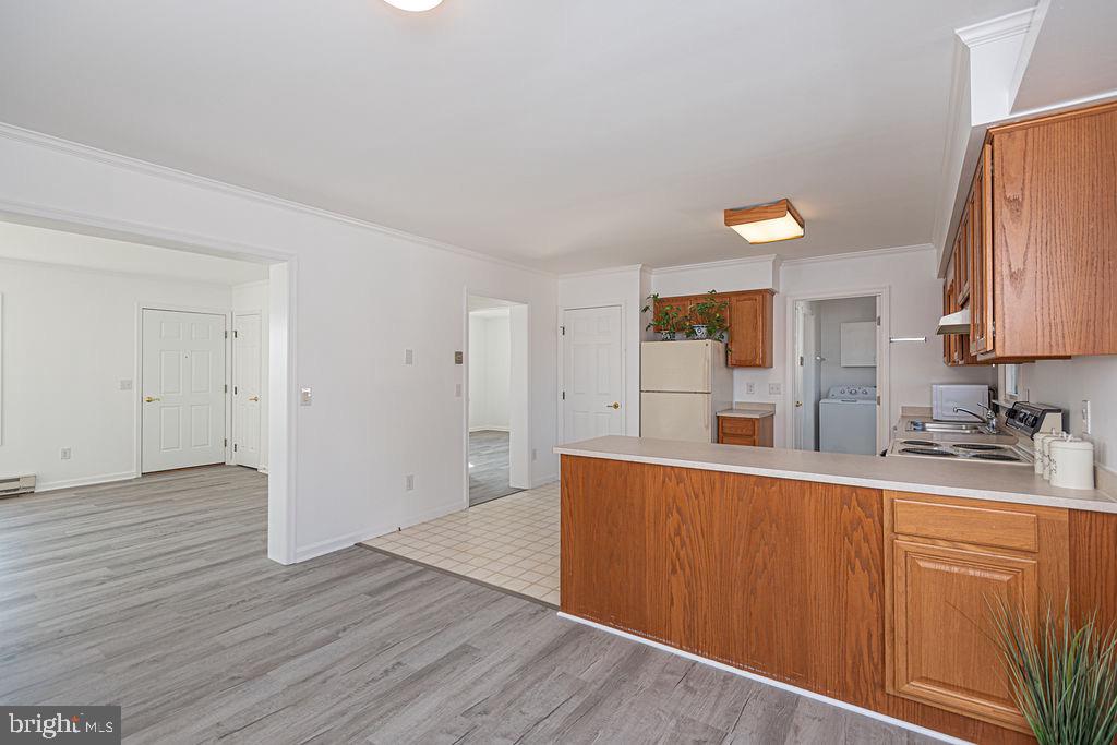 36130 Richland Road Willards, MD 21874 - Photo 31 of 42 a view of a kitchen with wooden floor and electronic appliances