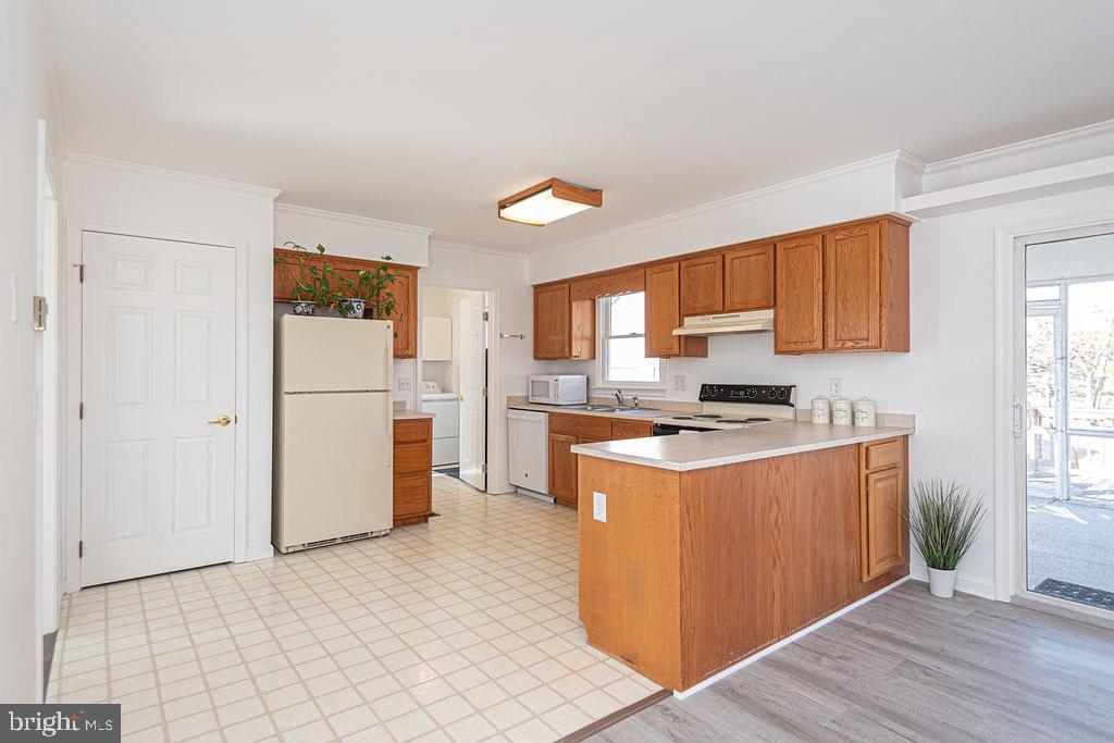 36130 Richland Road Willards, MD 21874 - Photo 6 of 42 a kitchen with stainless steel appliances granite countertop a refrigerator stove and sink