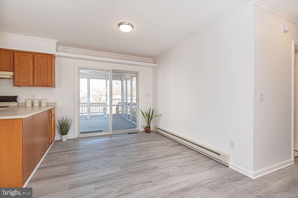 36130 Richland Road Willards, MD 21874 - Photo 8 of 42 a view of empty room with wooden floor and fan