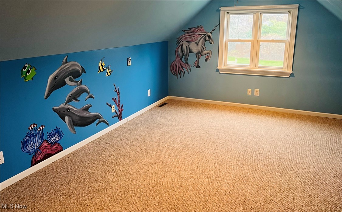 11525 Rapp Road New Middletown, OH 44442 - Photo 22 of 32 Workout area featuring carpet floors and vaulted ceiling
