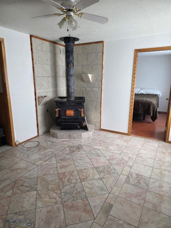 331 North Walnut Street Dillon, MT 59725 - Photo 18 of 30 Front room marble tile, wood burning stove