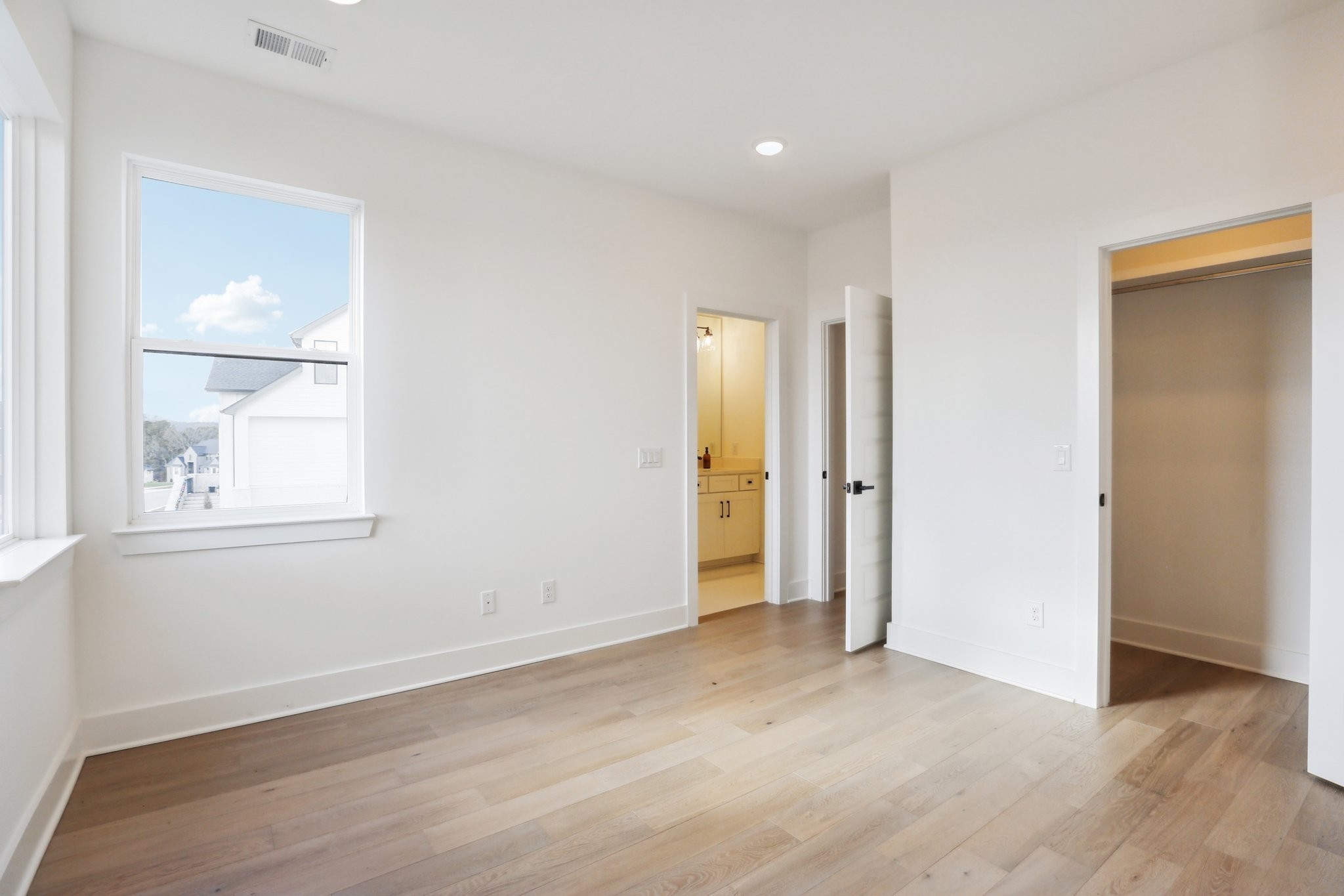 6100 Lookaway Circle Franklin, TN 37067 - Photo 29 of 92 an empty room with wooden floor and windows