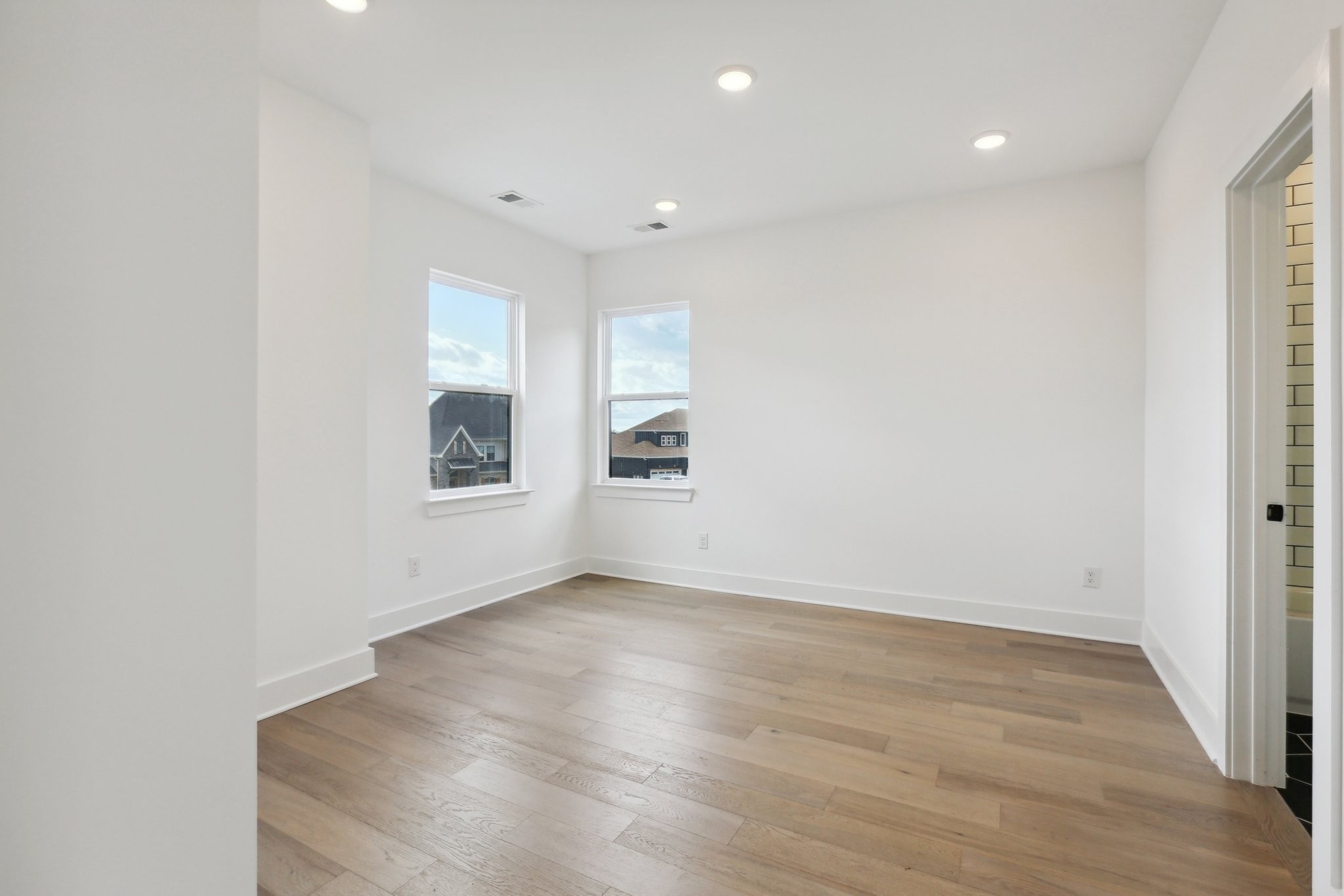6100 Lookaway Circle Franklin, TN 37067 - Photo 34 of 92 an empty room with wooden floor and windows
