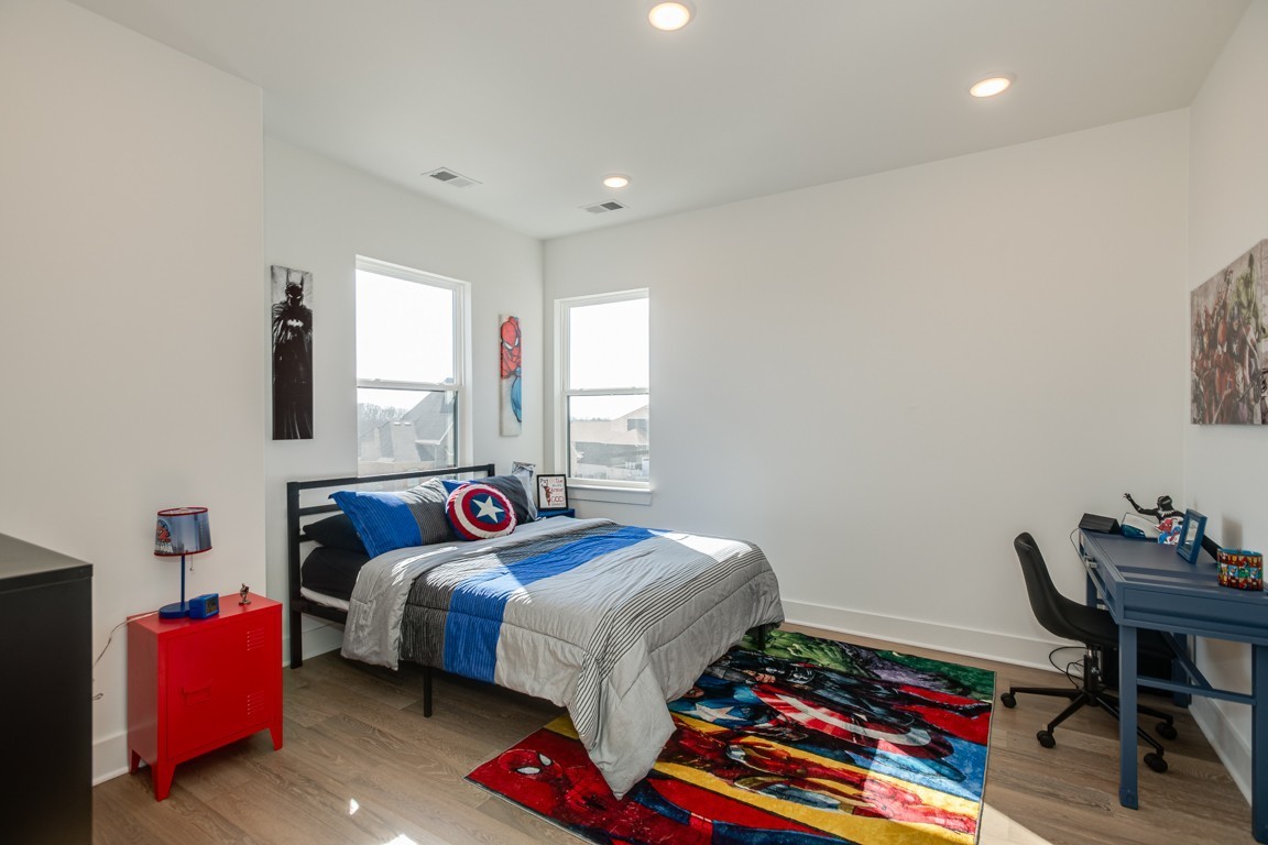 6100 Lookaway Circle Franklin, TN 37067 - Photo 63 of 92 a bedroom with a bed and a table in it