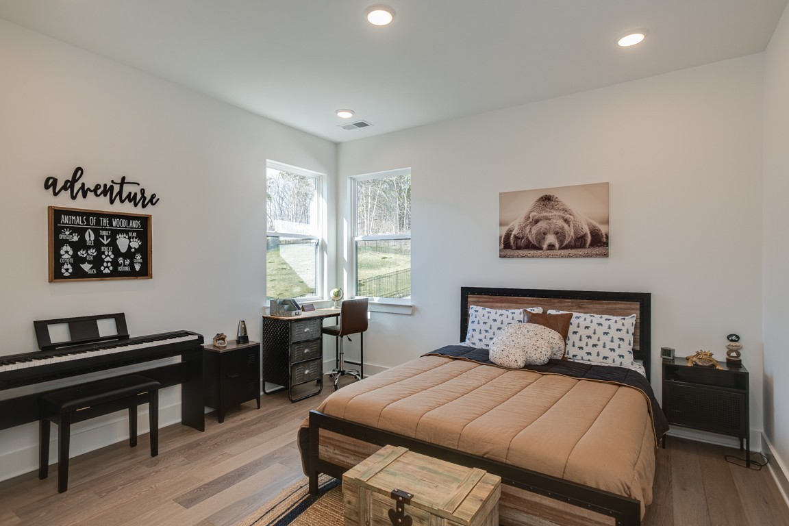 6100 Lookaway Circle Franklin, TN 37067 - Photo 66 of 92 a bedroom with a bed and a table in it