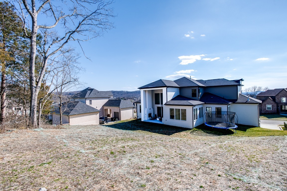 6100 Lookaway Circle Franklin, TN 37067 - Photo 78 of 92 a view of a house with a yard covered in snow